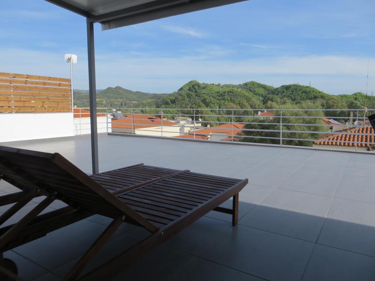 Leonidaion Guesthouse Ancient Olympia Exteriör bild A roof terrace in Spain